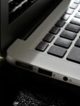 Free Detailed view of a silver laptop showing keyboard and multiple ports. Stock Photo